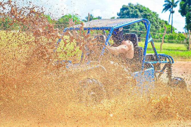 Buggy Tour in Punta Cana with Stops at the Beach and a Cave - Macao Beach stop: waves, sand, and limestone cliff views