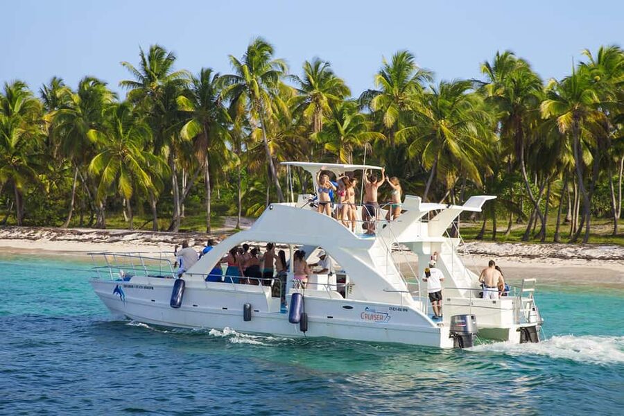 From Bavaro, Punta Cana: Boat Party, Snorkeling, Drinks, Snacks, and Transportation - Boarding the Catamaran: Slide, Music, Open Bar