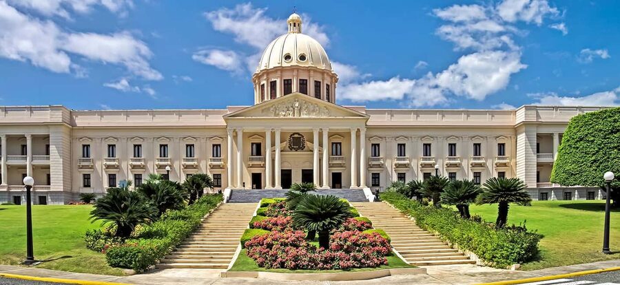 From Bavaro: Santo Domingo Colonial City Tour - National Palace and Columbus Lighthouse: two icons with different meanings