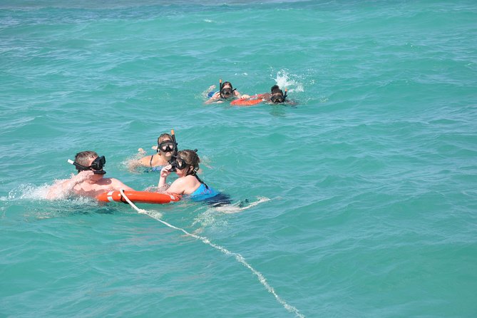 Great Snorkeling Cruise with Sharks & Stingray Encounter and Natural Pool - Getting started at Bavaro Beach: the shaded meet-and-greet moment