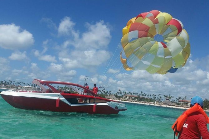 Parasailing Adventure Punta Cana - The coastline you’ll fly over: blue water and coconut trees