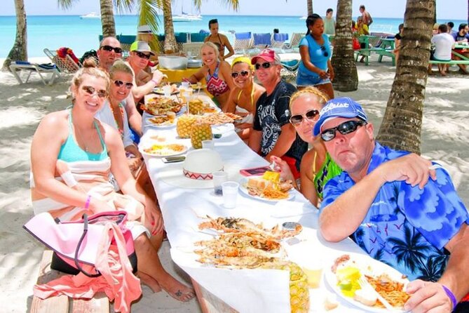 Saona Island Catamaran Adventure with Free Food and Transportation - Return catamaran cruise: snacks, unlimited drinks, loud music, and waiting
