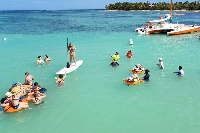 Small-Group Cruising and Snorkeling Catamaran Tour - Onboard vibe with Happy Fish: hammocks, restrooms, and the drink flow